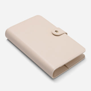 Cream personalosed binder with gold snap button closure angled view