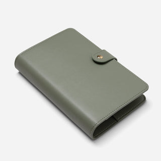 An olive green leather planner cover with a snap-button closure, shown on a clean white background.