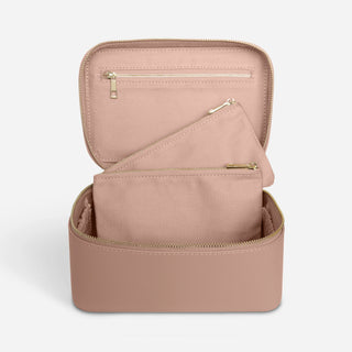 Open nude leather vanity case with two removable makeup pouches and internal zip pocket