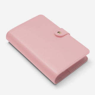 Pink a6 planner binder with gold snap button closure angled view